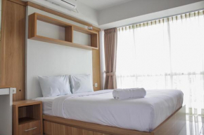 Modern 1BR Apartment with City View at H Residence By Travelio